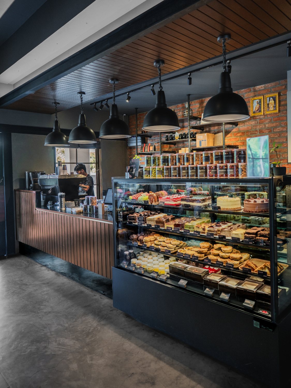 Roasted Sip Kiulap — the espresso bar, pendant lights and pastry case